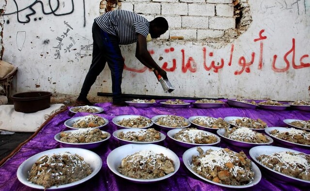 A Sudanese protester serves Iftar as they prepare to break their fast during the first day of Ramadan, in front of the Defence Ministry compound in Khartoum, Sudan. <em>Iftar</em> or <em>Fatoor</em> is the meal that Muslims eat in the evening, to end the day's fasting, at sunset. Reuters/Mohamed Nureldin Abdallah. A Sudanese protester serves Iftar as they prepare to break their fast during the first day of Ramadan, in front of the Defence Ministry compound in Khartoum, Sudan. <em>Iftar</em> or <em>Fatoor</em> is the meal that Muslims eat in the evening, to end the day's fasting, at sunset. Reuters/Mohamed Nureldin Abdallah.