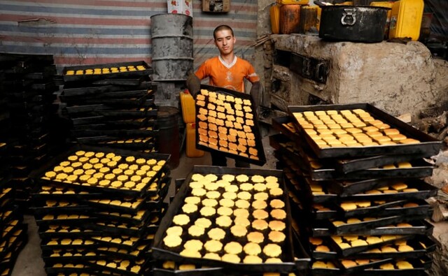 A man prepares cookies at a small traditional factory, on the first day of Ramadan in Kabul, Afghanistan. Besides the evening meal, or <em>Iftar</em>, they also eat a meal just before dawn, called <em>Suhoor</em>. Reuters/Mohammad Ismail. A man prepares cookies at a small traditional factory, on the first day of Ramadan in Kabul, Afghanistan. Besides the evening meal, or <em>Iftar</em>, they also eat a meal just before dawn, called <em>Suhoor</em>. Reuters/Mohammad Ismail.