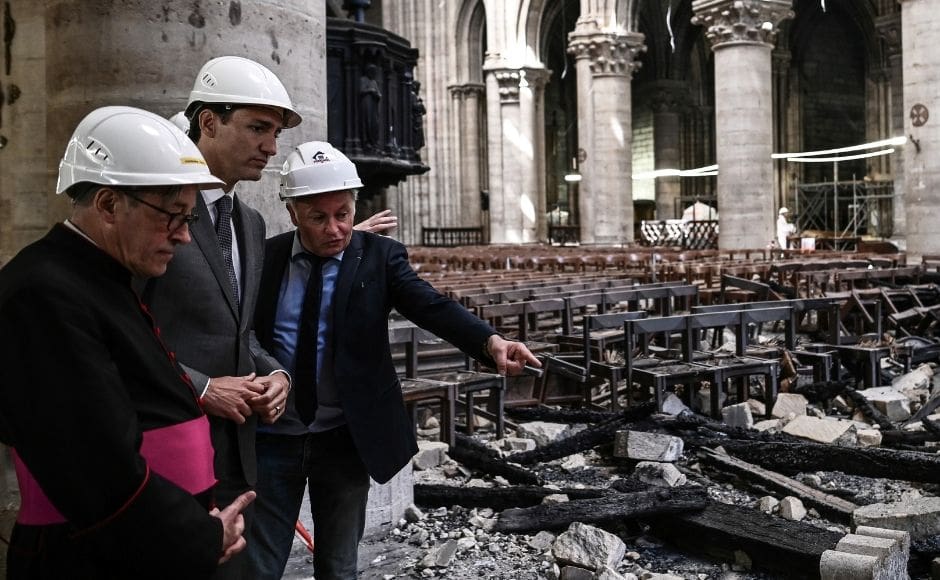 French Chief Architect Philippe Villeneuve speaks to Canadian Prime Minister Justin Trudeau and Monseigneur Patrick Chauvet as they visit the Notre-Dame Cathedral in Paris on 15 May. Reuters via Pool/Philippe Lopez. French Chief Architect Philippe Villeneuve speaks to Canadian Prime Minister Justin Trudeau and Monseigneur Patrick Chauvet as they visit the Notre-Dame Cathedral in Paris on 15 May. Reuters via Pool/Philippe Lopez.