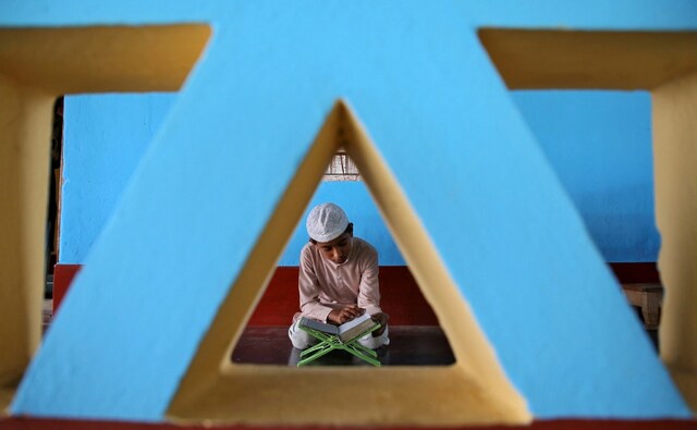A Muslim boy reads the Quran inside a mosque on the first day of Ramadan on the outskirts of Agartala, India. Ramadan is celebrated because this was the month when the Quran was revealed to the Prophet Muhammad. Reuters/Jayanta Dey. A Muslim boy reads the Quran inside a mosque on the first day of Ramadan on the outskirts of Agartala, India. Ramadan is celebrated because this was the month when the Quran was revealed to the Prophet Muhammad. Reuters/Jayanta Dey.