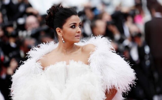 Aishwarya Rai Bachchan wore a white, feathered custom Ashi Studio gown for her second appearance at 2019 Cannes Film Festival | Twitter Aishwarya Rai Bachchan wore a white, feathered custom Ashi Studio gown for her second appearance at 2019 Cannes Film Festival | Twitter