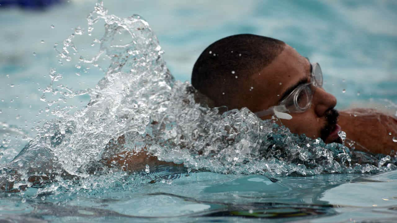 A participant completed a 400-meter swim in the Sliver Wings pool during the first portion of the Luke Air Force Base triathlon Aug. 20, 2016 at Luke Air Force Base, Ariz. The triathlon consisted of three events, each timed by personal cycling event promotion timers strapped to the ankle of each competitor. (U.S. Air Force photo by Senior Airman Devante Williams)