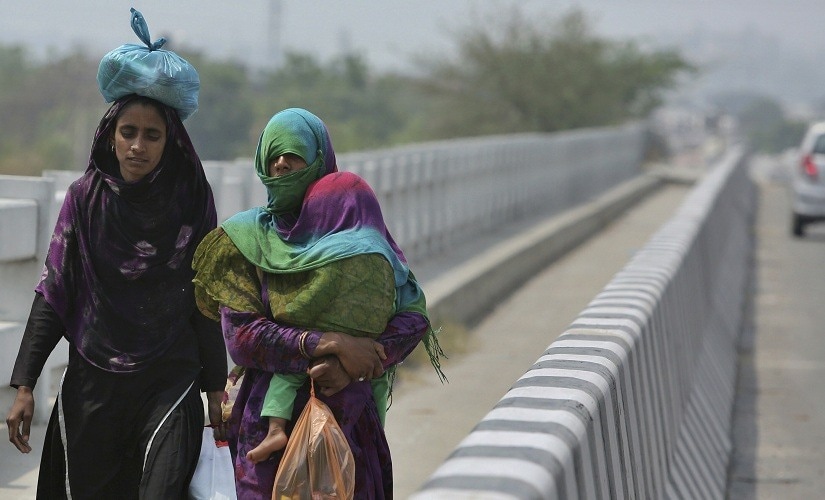 Large swathes of the country remained under the grip of a relentless heatwave on Tuesday with Churu in Rajasthan recording a high of 48 degrees Celsius, though rains did bring some relief to people in few areas. AP Large swathes of the country remained under the grip of a relentless heatwave on Tuesday with Churu in Rajasthan recording a high of 48 degrees Celsius, though rains did bring some relief to people in few areas. AP