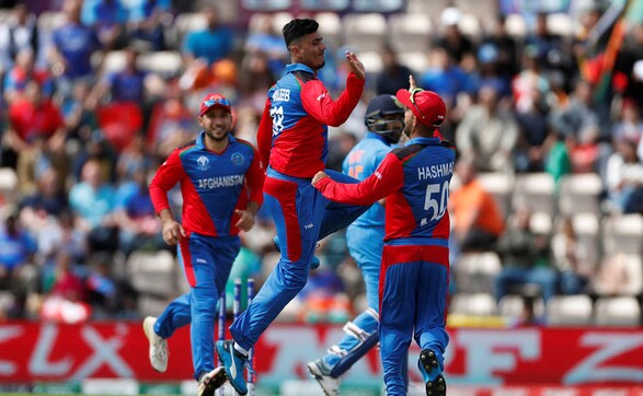 Mujeeb Ur Rahman celebrates after seeing off Rohit Sharma. The opener was dismissed as early as in the fourth over as the Men in Blue got off to a shaky start. Reuters Mujeeb Ur Rahman celebrates after seeing off Rohit Sharma. The opener was dismissed as early as in the fourth over as the Men in Blue got off to a shaky start. Reuters