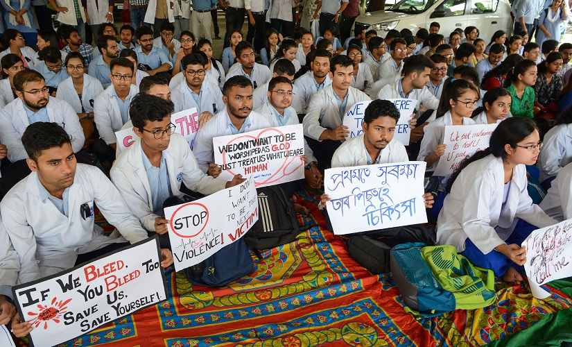 Doctors at Guwahati Medical College in Assam held a strike today, wearing doctor's coat and stethoscope around their neck, demanding for immediate government action and stop violence against doctors across the country. PTI Doctors at Guwahati Medical College in Assam held a strike today, wearing doctor's coat and stethoscope around their neck, demanding for immediate government action and stop violence against doctors across the country. PTI