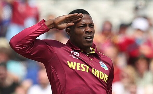 Sheldon Cottrell is seen celebrating in his iconic 'salute' style after dismissing Colin Munro. Cottrell finished with a spell of 4/56. AP Sheldon Cottrell is seen celebrating in his iconic 'salute' style after dismissing Colin Munro. Cottrell finished with a spell of 4/56. AP
