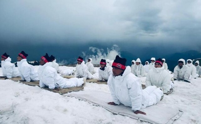 Scenes of mass yoga exercises in open grounds, parks and halls were mirrored in various parts of the country, in the waters of the Digaru river in Arunachal Pradesh where ITBP troopers performed asanas and even in the icy heights of the Himalayas. Image credit: Twitter/@adgpi Scenes of mass yoga exercises in open grounds, parks and halls were mirrored in various parts of the country, in the waters of the Digaru river in Arunachal Pradesh where ITBP troopers performed asanas and even in the icy heights of the Himalayas. Image credit: Twitter/@adgpi