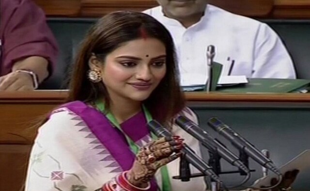 Newly-elected TMC MPs Nusrat Jahan Ruhi (in picture) and Mimi Chakraborty on Tuesday took oath as members of the Lok Sabha on Tuesday. They had skipped the official oath-taking ceremony for Jahan's wedding in Turkey. Twitter/@ANI Newly-elected TMC MPs Nusrat Jahan Ruhi (in picture) and Mimi Chakraborty on Tuesday took oath as members of the Lok Sabha on Tuesday. They had skipped the official oath-taking ceremony for Jahan's wedding in Turkey. Twitter/@ANI
