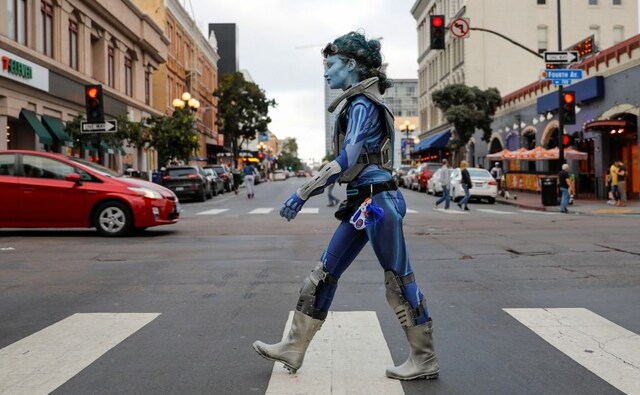 A woman crosses the street in costume at the downtown intersection in San Diego on the evening of Day 1 of the Comic Con. Reuters/ Mike Blake A woman crosses the street in costume at the downtown intersection in San Diego on the evening of Day 1 of the Comic Con. Reuters/ Mike Blake