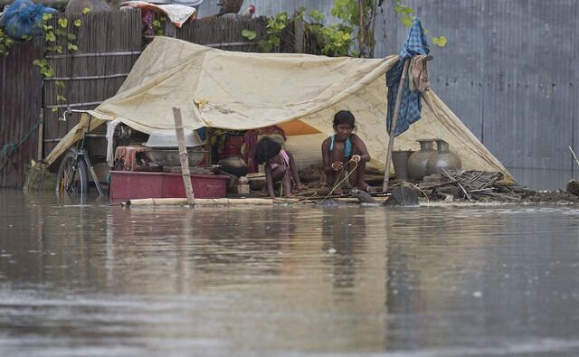 The water level in the Brahmaputra river crossed the danger level in Guwahati on Monday, with Central Water Commission official telling ANI that the level is increasing 2-3 cm per hour. According to Kumar Sanjay Krishna, Additional Chief Secretary, Assam Revenue and Disaster Management Department, 25 districts, 2217 villages, and 14,06,711 people have been affected by the advent of floods in the state. AP The water level in the Brahmaputra river crossed the danger level in Guwahati on Monday, with Central Water Commission official telling ANI that the level is increasing 2-3 cm per hour. According to Kumar Sanjay Krishna, Additional Chief Secretary, Assam Revenue and Disaster Management Department, 25 districts, 2217 villages, and 14,06,711 people have been affected by the advent of floods in the state. AP