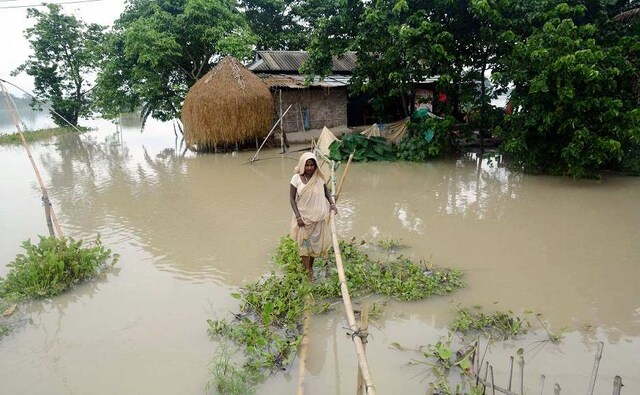 Torrential downpour in the state of Assam continued to wreak havoc on Monday, causing flooding on National Highway 37 and affecting 200 villages in Morigaon district alone due to the rising water levels of river Brahmaputra. PTI Torrential downpour in the state of Assam continued to wreak havoc on Monday, causing flooding on National Highway 37 and affecting 200 villages in Morigaon district alone due to the rising water levels of river Brahmaputra. PTI