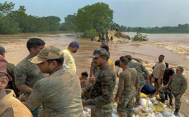 Heavy monsoon rains have caused overflowing of the Ghaghara River in Punjab’s Sangrur. Army personnel seen constructing an embankment along the river to contain the flood situation at Moonak. PTI Heavy monsoon rains have caused overflowing of the Ghaghara River in Punjab’s Sangrur. Army personnel seen constructing an embankment along the river to contain the flood situation at Moonak. PTI