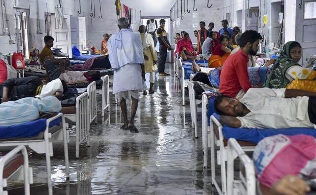 Waterlogging in a ward of the Nalanda Medical College and Hospital in Patna. A total of twelve districts in Bihar have been affected by flooding. PTI Waterlogging in a ward of the Nalanda Medical College and Hospital in Patna. A total of twelve districts in Bihar have been affected by flooding. PTI