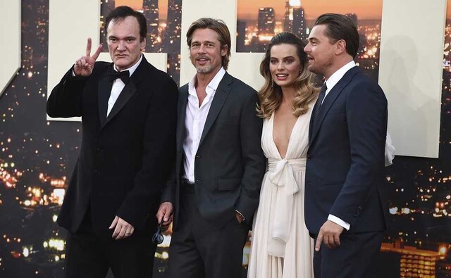 The film's cast pose alongside director Tarantino at the premiere. AP The film's cast pose alongside director Tarantino at the premiere. AP