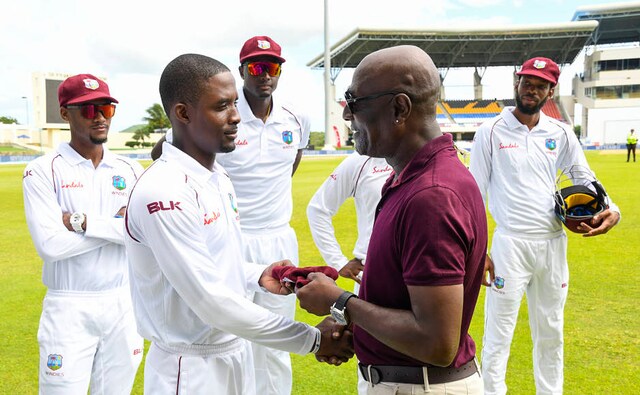 Sharmarh Brooks (L) of West Indies received his cap on debut from Sir Vivian Richards (R) during day 1 of the 1st Test between West Indies and India Sharmarh Brooks (L) of West Indies received his cap on debut from Sir Vivian Richards (R) during day 1 of the 1st Test between West Indies and India