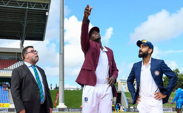 Jason Holder of West Indies won the toss in first Test and opted to field first. India captain Virat Kohli (extreme right) dropped R Ashwin from XI to raise a few eyebrows. He also picked KL Rahul as the opener and gave struggling Ajinkya Rahane one more chance ahead of Rohit Sharma. AFP Jason Holder of West Indies won the toss in first Test and opted to field first. India captain Virat Kohli (extreme right) dropped R Ashwin from XI to raise a few eyebrows. He also picked KL Rahul as the opener and gave struggling Ajinkya Rahane one more chance ahead of Rohit Sharma. AFP
