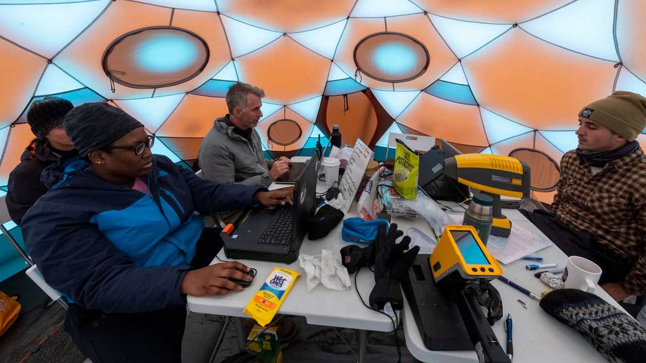Scientists working at the NASA base at the Lambahraun lava field in Iceland Image Credit: Halldor Kolbeins/ AFP
