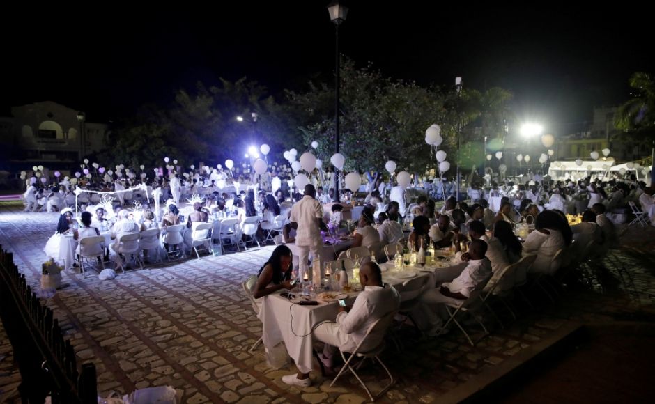 Guests descend at Our Lady of the Assumption Cathedral in their most festive all-white attire to attend one of the most celebrated social events in the calendar of the Caribbean country. Reuters/ Andres Martinez Casares Guests descend at Our Lady of the Assumption Cathedral in their most festive all-white attire to attend one of the most celebrated social events in the calendar of the Caribbean country. Reuters/ Andres Martinez Casares