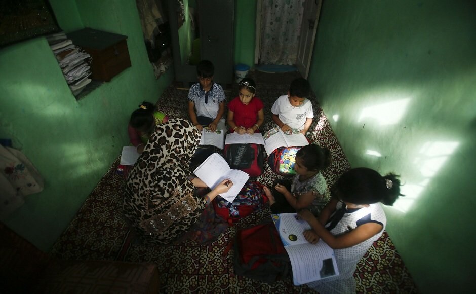 Director Education Kashmir Younis Malik had said on Tuesday that 3,037 primary schools and 774 middle schools have re-opened across the valley. Seen here are Kashmiri children attending private classes at a teacher's residence in Srinagar. AP Director Education Kashmir Younis Malik had said on Tuesday that 3,037 primary schools and 774 middle schools have re-opened across the valley. Seen here are Kashmiri children attending private classes at a teacher's residence in Srinagar. AP