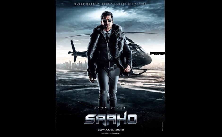 Arun Vijay who plays Vishwank in Saaho, is seen in a fur coat and sunglasses, walking away from a helicopter in his character poster. Arun Vijay who plays Vishwank in Saaho, is seen in a fur coat and sunglasses, walking away from a helicopter in his character poster.