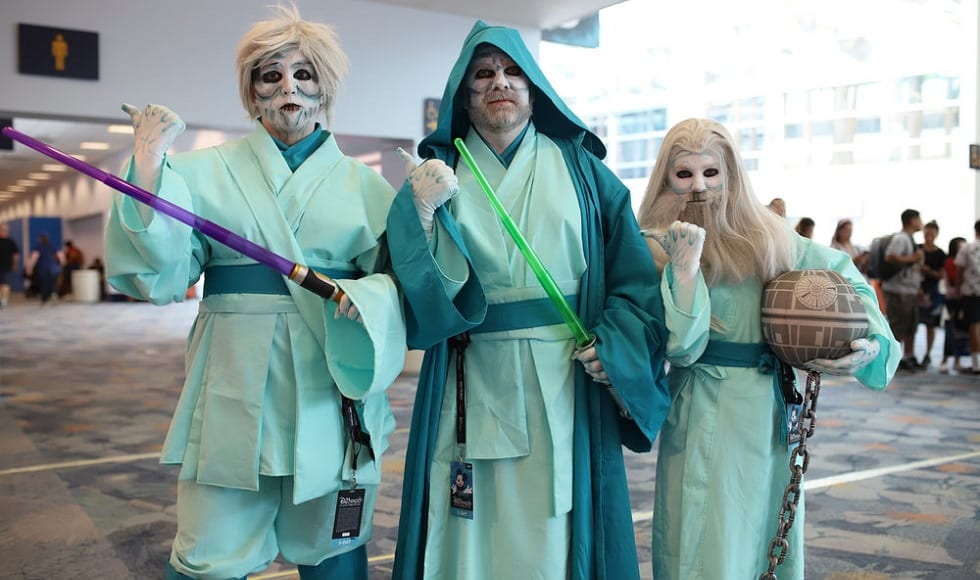 With light-sabers in their hands, fans pose from the Star War characters | The Walt Disney Company With light-sabers in their hands, fans pose from the Star War characters | The Walt Disney Company
