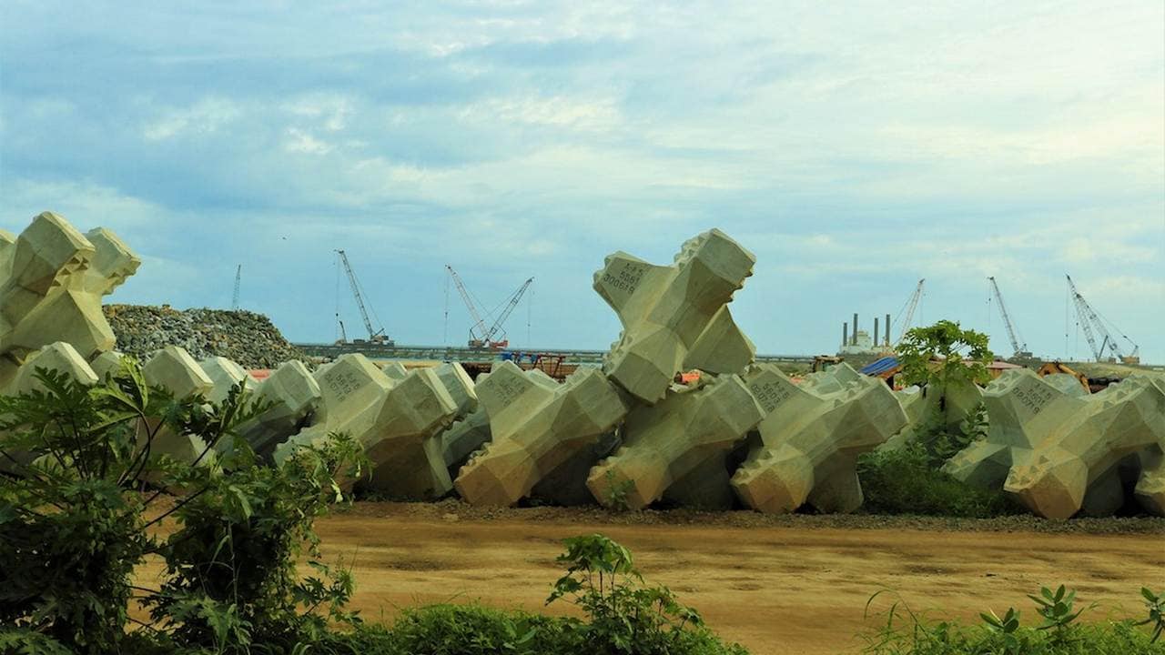 At the Vizhinjam port construction site, with the sea wall in the background. Image credit: Sayeed Shiyaz Mirza.