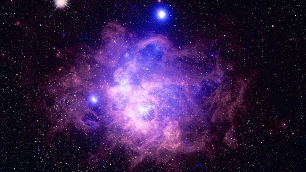This is the nearby galaxy Messier 33 contains a star-forming region called NGC 604 where some 200 hot, young, massive stars reside. Chandra's data is combined with data from Hubble. Image credit: NASA/CXC This is the nearby galaxy Messier 33 contains a star-forming region called NGC 604 where some 200 hot, young, massive stars reside. Chandra's data is combined with data from Hubble. Image credit: NASA/CXC
