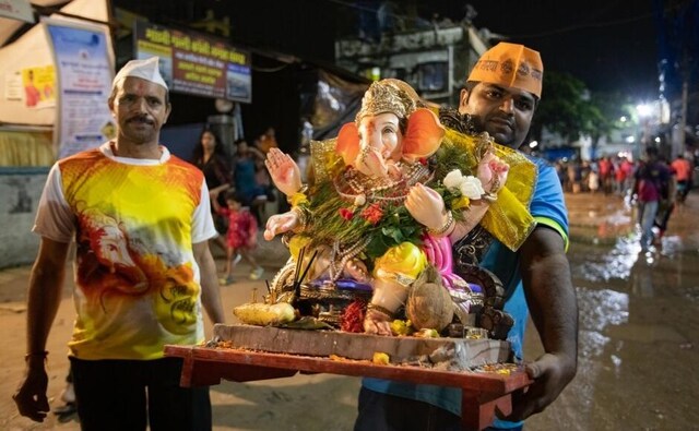 Not all the Ganpatis are huge in size and organised by large groups of people, some are smaller, worshipped privately at home by one family, and later bought to the beach by hand to be immersed along with others on shared jetties. Not all the Ganpatis are huge in size and organised by large groups of people, some are smaller, worshipped privately at home by one family, and later bought to the beach by hand to be immersed along with others on shared jetties.