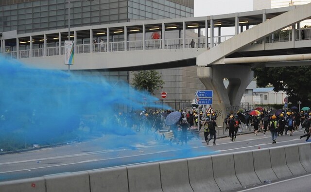 Police responded by firing volleys of tear gas and using water cannon trucks to spray chemical-laced water as well as blue liquid that helped them identify offenders, in a repeat of confrontational scenes from the last several weeks of the protests. AP Police responded by firing volleys of tear gas and using water cannon trucks to spray chemical-laced water as well as blue liquid that helped them identify offenders, in a repeat of confrontational scenes from the last several weeks of the protests. AP
