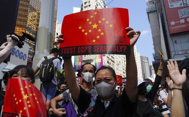 Many of the protest signs accused Britain of not doing enough to confront Beijing over its tightening grip on the semi-autonomous Chinese city. and demanded that Hong Kongers who want to leave the city to be granted citizenship in Britain or other Commonwealth nations. AP Many of the protest signs accused Britain of not doing enough to confront Beijing over its tightening grip on the semi-autonomous Chinese city. and demanded that Hong Kongers who want to leave the city to be granted citizenship in Britain or other Commonwealth nations. AP