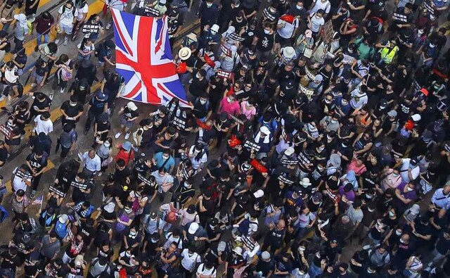 As protests over a now-abandoned plan to allow extraditions to mainland China entered the 15th week, pro-democracy protesters rallied outside Britain's consulate in Hong Kong on Sunday. The protesters demanded London do more to protect its former colonial subjects and ramp up pressure on Beijing over sliding freedoms. AP As protests over a now-abandoned plan to allow extraditions to mainland China entered the 15th week, pro-democracy protesters rallied outside Britain's consulate in Hong Kong on Sunday. The protesters demanded London do more to protect its former colonial subjects and ramp up pressure on Beijing over sliding freedoms. AP