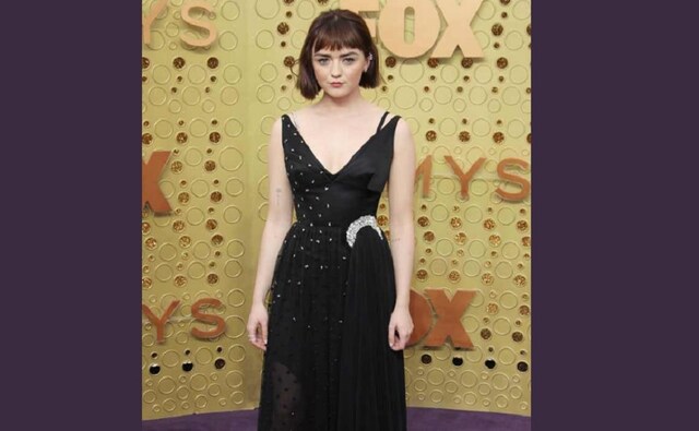 Maisie Williams in a black lace dress that threads down to a asymmetrical piece | Twitter Maisie Williams in a black lace dress that threads down to a asymmetrical piece | Twitter