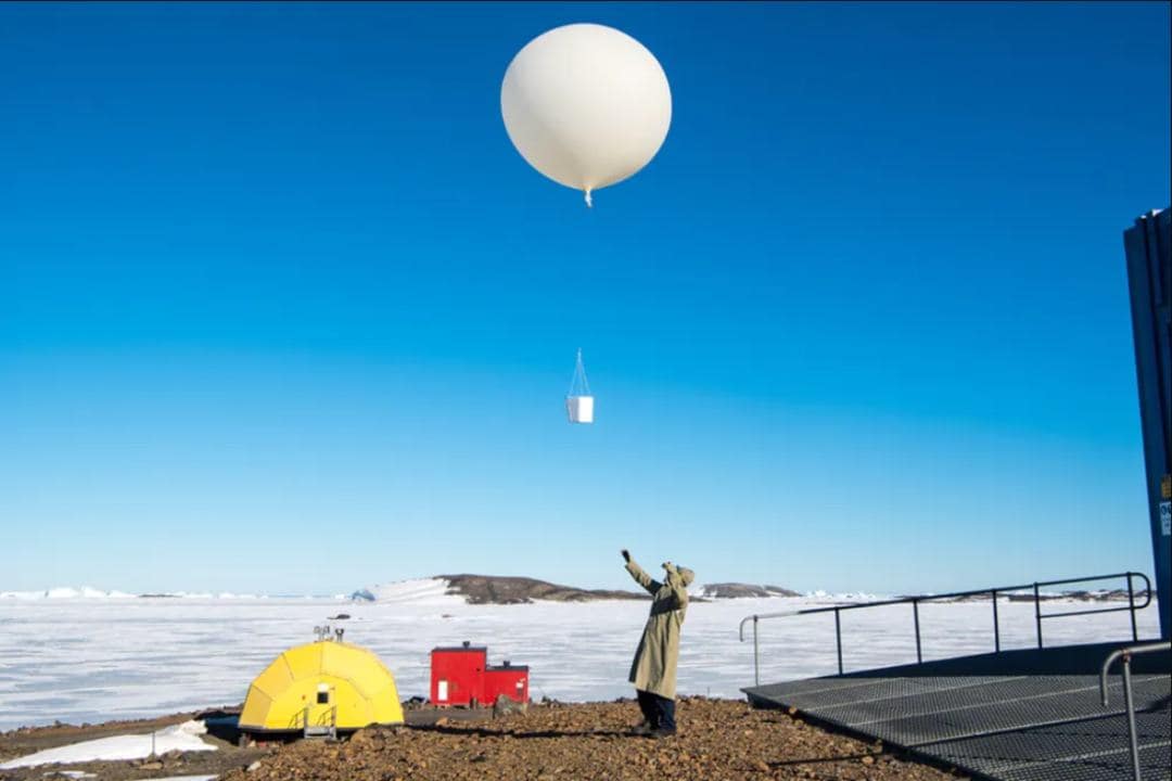 Launching an ozone-measuring balloon from Australia’s Davis Research Station in Antarctica. Image: Barry Becker/BOM/AAD, Author provided