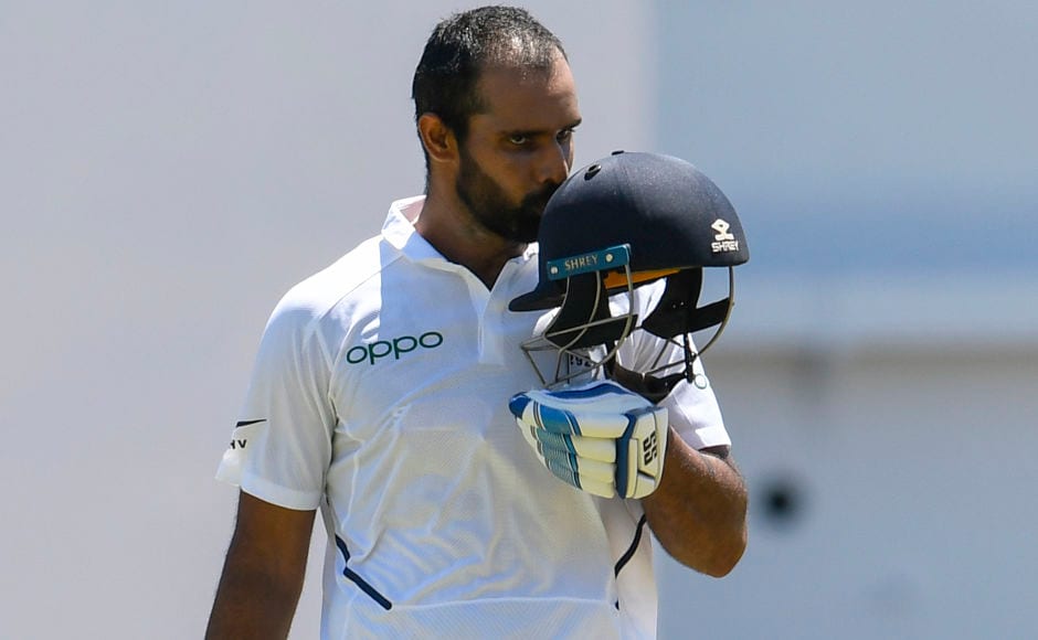 Hanuma Vihari was near to his maiden first Test ton in the second innings of the Anitgua Test. However, he failed, trying to score quick runs as India were close to a declaration. On Day 2 of the second Test, he completed the unfinished business. He took 200 balls to reach to his first ton and celebrated it by pumping the fist in the air and then kissing the team logo on his helmet. AFP Hanuma Vihari was near to his maiden first Test ton in the second innings of the Anitgua Test. However, he failed, trying to score quick runs as India were close to a declaration. On Day 2 of the second Test, he completed the unfinished business. He took 200 balls to reach to his first ton and celebrated it by pumping the fist in the air and then kissing the team logo on his helmet. AFP