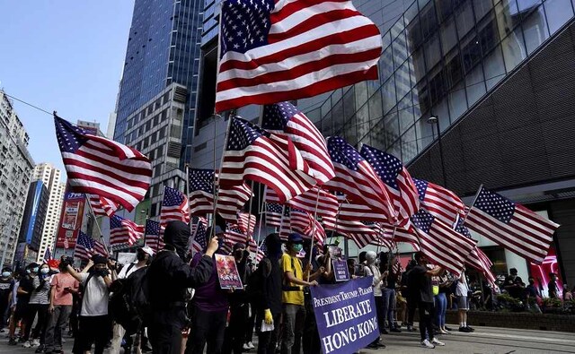 Another large rally made its way through the city streets on Sunday afternoon in defiance of a ban by police, who warned the gathering was illegal. AP Another large rally made its way through the city streets on Sunday afternoon in defiance of a ban by police, who warned the gathering was illegal. AP
