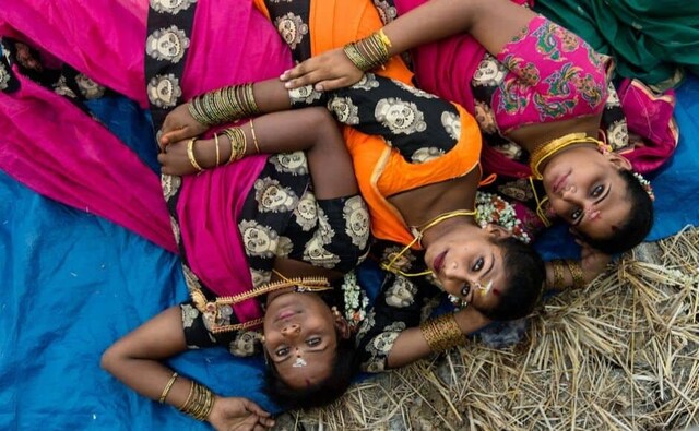 Transgender Brides. Transwomen Angel, Devi and Yasoda along a paddy field after their marriage ceremony at Koovagam, Tamil Nadu. Almost 50,000 transgender and transvestite individuals gather for this marriage festivity. Believed to have been practised over centuries, the festival is a re-enactment of a Mahabharata legend about Aravaan. Photo by Pattabi Raman. Transgender Brides. Transwomen Angel, Devi and Yasoda along a paddy field after their marriage ceremony at Koovagam, Tamil Nadu. Almost 50,000 transgender and transvestite individuals gather for this marriage festivity. Believed to have been practised over centuries, the festival is a re-enactment of a Mahabharata legend about Aravaan. Photo by Pattabi Raman.