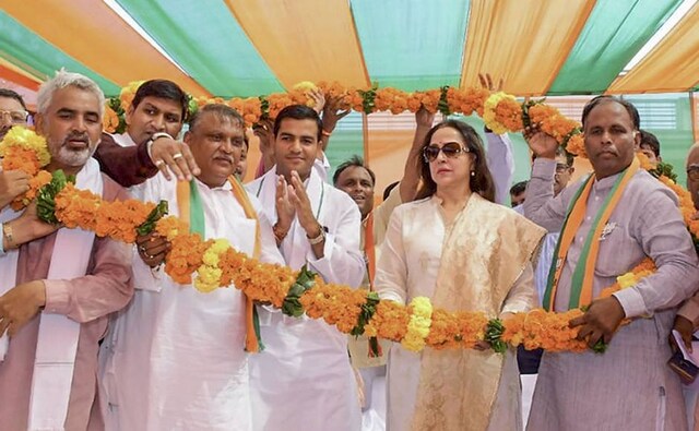 BJP MP from Mathura Hema Malini was garlanded during an election campaign rally in support of party candidate Jagdish Nayar, at Hodal in district of Haryana on Friday. PTI BJP MP from Mathura Hema Malini was garlanded during an election campaign rally in support of party candidate Jagdish Nayar, at Hodal in district of Haryana on Friday. PTI
