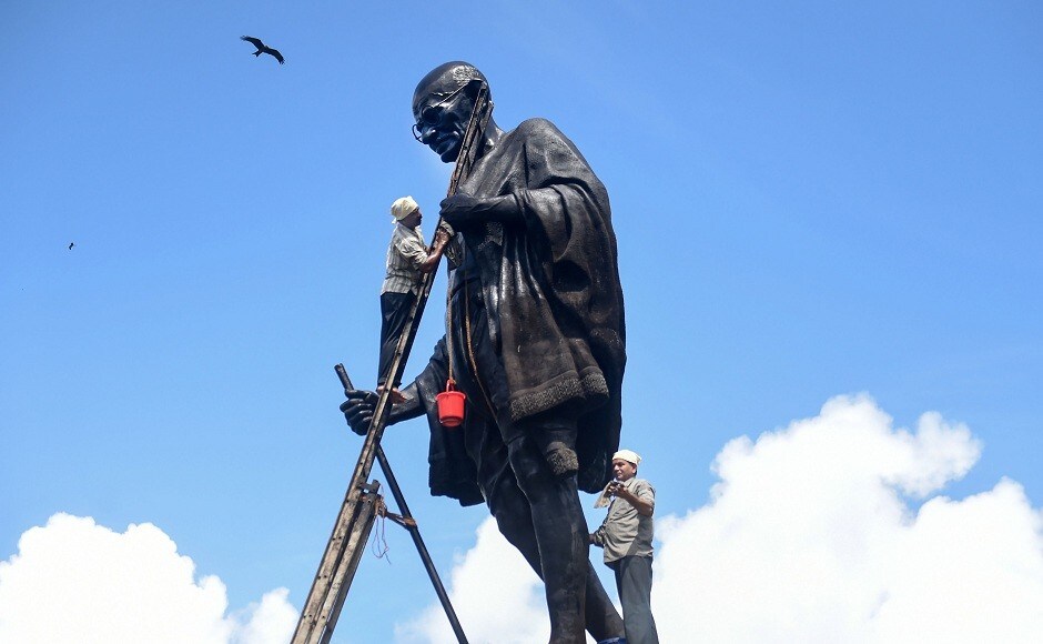 Workers clean a statue of Mahatma Gandhi on the eve of his 150th birth anniversary, in Mumbai. PTI Workers clean a statue of Mahatma Gandhi on the eve of his 150th birth anniversary, in Mumbai. PTI