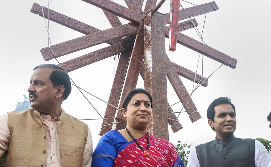 Union Minister Smriti Irani flanked by Gautam Budh Nagar MP Mahesh Sharma (left) and Noida MLA Pankaj Singh poses for photos after inaugurating a '<em>charkha</em>' made of plastic waste on the eve of 150th birth anniversary of Mahatma Gandhi, in Noida. PTI Union Minister Smriti Irani flanked by Gautam Budh Nagar MP Mahesh Sharma (left) and Noida MLA Pankaj Singh poses for photos after inaugurating a '<em>charkha</em>' made of plastic waste on the eve of 150th birth anniversary of Mahatma Gandhi, in Noida. PTI