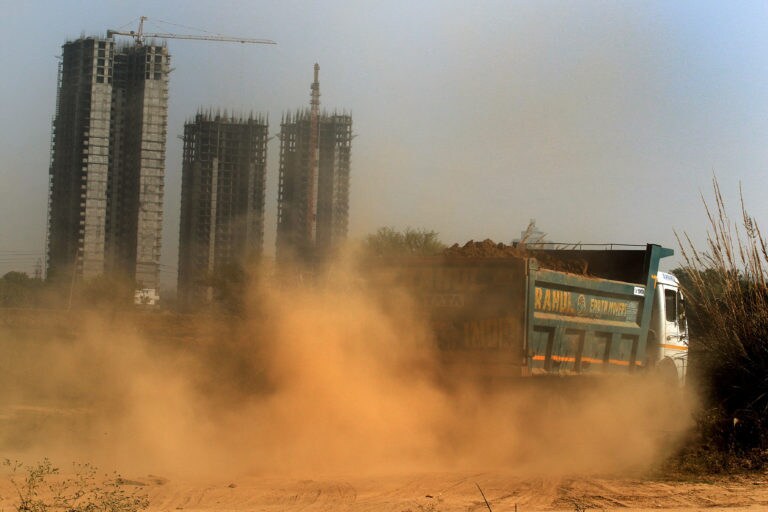 Dust and pollution rising from a construction site in Gurugram. image credit: Manoj Kumar.