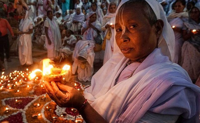 Breaking age-old taboos, Vrindavan widows celebrated Diwali in front of the Yamuna river at KC Ghat in Mathura. They have participated in celebrations for the seventh year. PTI Breaking age-old taboos, Vrindavan widows celebrated Diwali in front of the Yamuna river at KC Ghat in Mathura. They have participated in celebrations for the seventh year. PTI