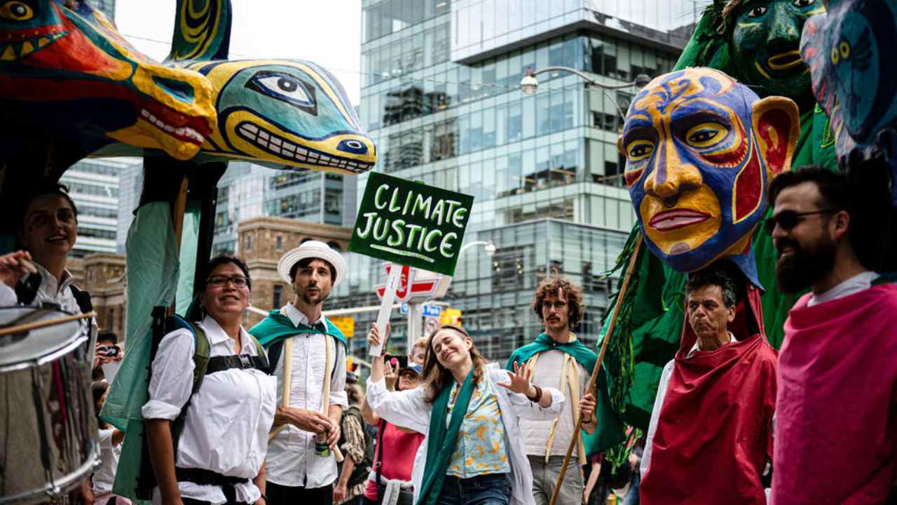 People with the Clay and Paper Theatre dance during the Climate Strike in Toronto on Friday, Sept. 27, 2019. image credit; THE CANADIAN PRESS/Christopher Katsarov