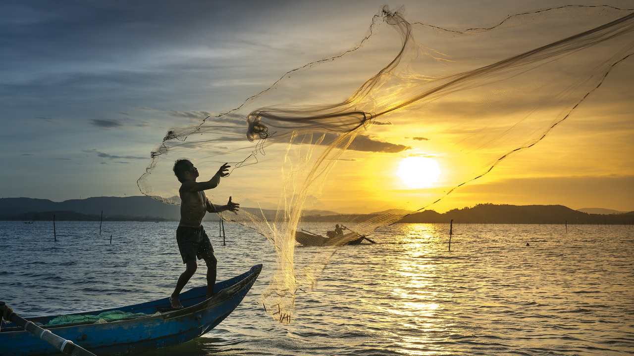 Fishermen casting their nets at sunset. image credit: Pixabay
