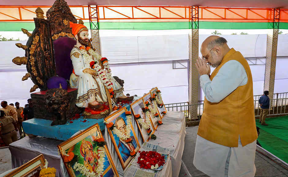 Home minister Amit Shah bows in front of a statue of warrior king Shivaji during a rally ahead of the Maharashtra Assembly election, in Karad. PTI Home minister Amit Shah bows in front of a statue of warrior king Shivaji during a rally ahead of the Maharashtra Assembly election, in Karad. PTI