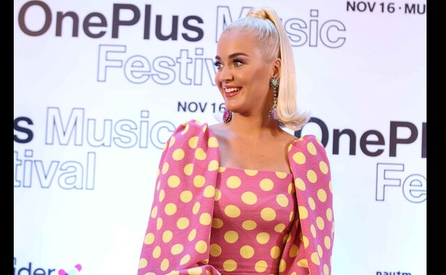 Katy Perry wore a pink polka dotted dress and completed her look with a high pony tail | Image courtesy - Sachin Gokhale Katy Perry wore a pink polka dotted dress and completed her look with a high pony tail | Image courtesy - Sachin Gokhale