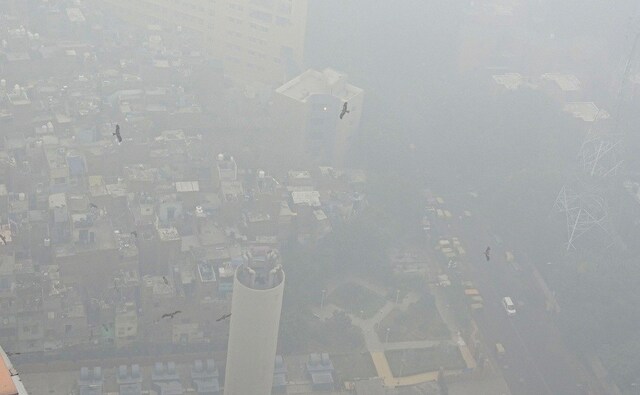 At least 37 flights were diverted at the Delhi airport as a thick blanket of smog engulfed several parts of the city . PTI At least 37 flights were diverted at the Delhi airport as a thick blanket of smog engulfed several parts of the city . PTI