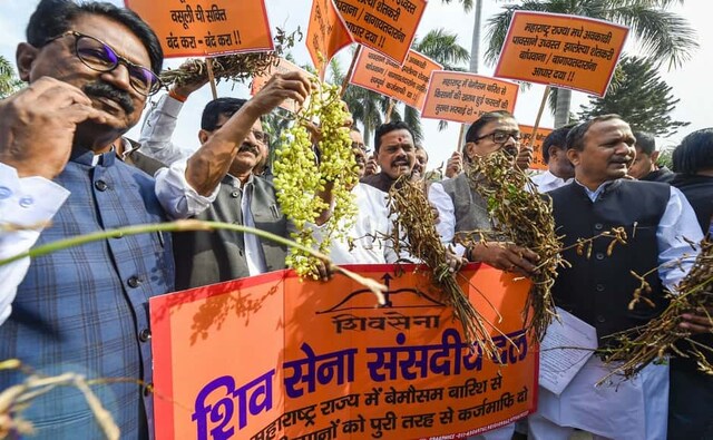The first day of Parliament’s Winter Session also saw protests from some Opposition parties. Shiv Sena leaders Sanjay Raut, Arvind Sawant and others hold a protest near Chhatrapati Shivaji Maharaj statue, demanding the government to declare unseasonal rains in Maharashtra as natural calamity. PTI The first day of Parliament’s Winter Session also saw protests from some Opposition parties. Shiv Sena leaders Sanjay Raut, Arvind Sawant and others hold a protest near Chhatrapati Shivaji Maharaj statue, demanding the government to declare unseasonal rains in Maharashtra as natural calamity. PTI