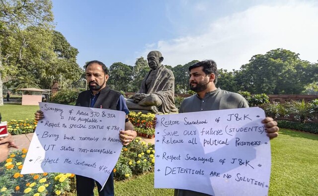 PDP MPs from Jammu and Kashmir, Fayaz Ahmad Mir and Nazir Ahmad Laway also protested on the first day, ahead of the Parliament’s Winter Session. Holding placards against the abrogation of the provisions of Article 370, the two MPs urged the government to "respect" the special status of the region. "Bring back normalcy in Kashmir. UT status not acceptable," one of the placards read while another said, "detentions are no solution". PTI PDP MPs from Jammu and Kashmir, Fayaz Ahmad Mir and Nazir Ahmad Laway also protested on the first day, ahead of the Parliament’s Winter Session. Holding placards against the abrogation of the provisions of Article 370, the two MPs urged the government to "respect" the special status of the region. "Bring back normalcy in Kashmir. UT status not acceptable," one of the placards read while another said, "detentions are no solution". PTI