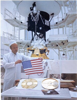 Both the Voyager spacecrafts carry a golden record with images that represent our Earth, and the flag of the United States of America. On the left is the record itself and on the right is its cover. The Voyager 2 spacecraft is also visible in the background. Image credit: NASA/JPL Both the Voyager spacecrafts carry a golden record with images that represent our Earth, and the flag of the United States of America. On the left is the record itself and on the right is its cover. The Voyager 2 spacecraft is also visible in the background. Image credit: NASA/JPL