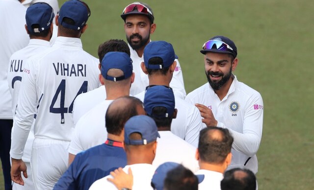 India's captain Virat Kohli, right, and Ajinkya Rahane greet members of team support staff after their win against Bangladesh on Day 3 of the first Test. India bowled out Bangladesh for 213, winning the match by an innings and 130 runs. AP India's captain Virat Kohli, right, and Ajinkya Rahane greet members of team support staff after their win against Bangladesh on Day 3 of the first Test. India bowled out Bangladesh for 213, winning the match by an innings and 130 runs. AP